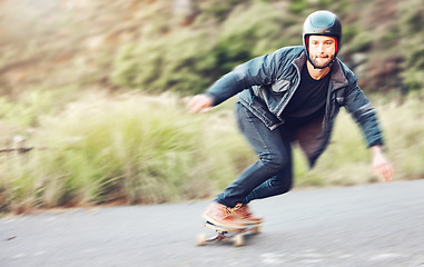 Image showing Sports, skateboard and man skating on road for fitness, exercise or wellness. Training, freedom and portrait of male skater moving with fast speed, skateboarding or riding outdoors for action workout