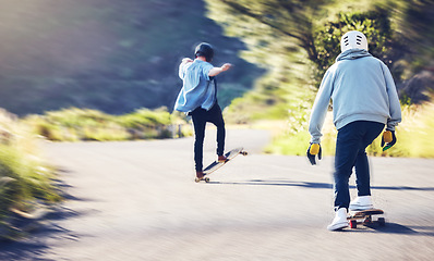 Image showing Friends, speed and longboard skating in road, men racing downhill with skateboard and helmet for safety. Extreme sports adventure, skateboarding street race and skateboarder tricks on mountain pass.