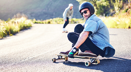 Image showing Road, skateboard sports and man skating for fitness, exercise and wellness. Training, sunglasses and male skater sitting on board, skateboarding and riding for action stunt, exercising or workout.