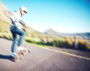 Image showing Blurred, fast and man skateboarding in the street for fitness, training and exercise in Brazil. Sport, speed and person doing tricks on a skateboard in the road for urban action, movement and balance