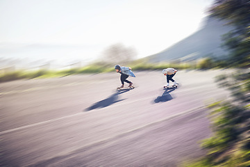 Image showing Skateboard, fast and people on road training, competition or danger, risk and adventure sports, above. Speed, blurred background and skater team moving on street for youth energy, balance and action