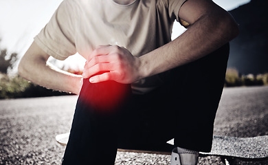 Image showing Knee pain, hands of man and skateboarder with injury after fall, accident or workout outdoors. Sports, fitness and male skater with fibromyalgia, arthritis or leg inflammation after skating exercise.