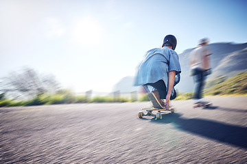 Image showing Speed, fast and men skateboarding in the street for adventure, training and exercise in Philippines. Fitness, sport and friends in motion, moving and travel in the road on a skateboard in summer