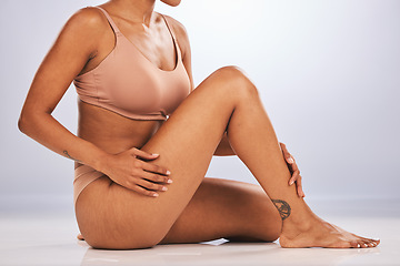 Image showing Legs, feet and body, black woman and beauty, skincare epilation and pedicure isolated on studio background. Health, wellness and grooming, waxing or laser hair removal, dermatology and cosmetic care