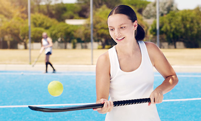 Image showing Tennis, racket and woman with ball for training, fitness and balance, practice and cardio at an outdoor court. Sports, girl and athletic professional excited, happy and getting ready for performance