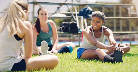 Image showing Stretching, fitness and sports women with teamwork, support and exercise, wellness and health on grass or field. Training, workout and athlete group of people in diversity, talking and relax on floor