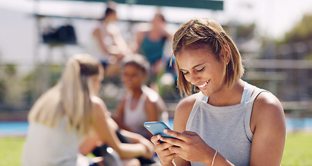 Image showing Woman, sport field and phone for texting, social media and communication for online dating, happy and smile. Gen z girl, smartphone and outdoor happiness for chat app, web or laugh at meme on website