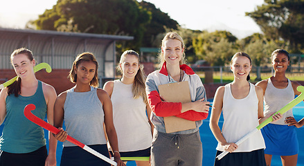 Image showing Portrait, hockey and a sports coach with her team standing outdoor together for training or a game. Teamwork, diversity and coaching with a female trainer outside with a girl group for sport