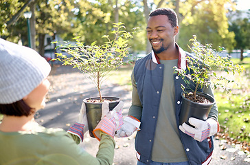 Image showing Teamwork, gardening and man with woman in a park happy and smiling for plant growth for sustainability in the environment. Volunteer, black man and people excited for planting as in a garden