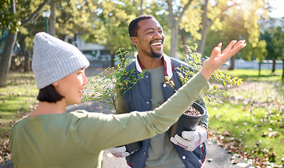 Image showing Volunteer team, plant and gardening in a park with trees in nature environment, agriculture or garden. Happy woman and man helping for growth, ecology and sustainability for community on Earth day