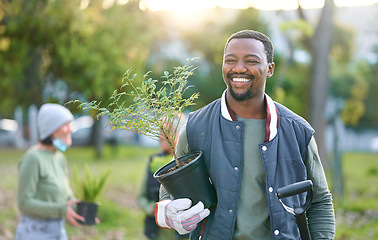 Image showing Agriculture, nature and black man with a plant in a park after doing sustainable gardening. Happy, smile and eco friendly African male gardener standing with greenery on outdoor field in countryside.