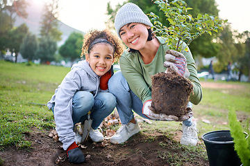 Image showing Family portrait, plant and gardening in a park with trees in nature environment, agriculture or garden. Happy volunteer woman and child planting for growth, ecology and sustainability of community