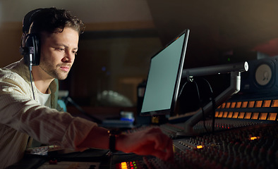 Image showing Musician, thinking or computer headphones for music recording, sound mixing or song composition in studio. Producer, DJ or man on technology with ideas for live streaming radio, audio or media album