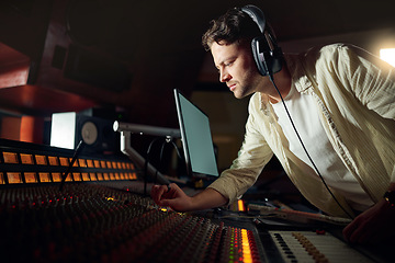 Image showing Dj, thinking or recording headphones for music, sound mixing or computer song composition in studio. Musician, man or producer on technology with ideas for live streaming radio, audio or media album