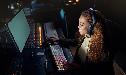 Image showing Woman, smile or musician headphones in computer music recording, sound engineering or song composition in studio. Producer, happy or DJ on technology in live streaming radio, edm audio or media album