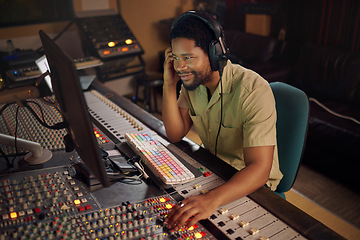 Image showing Computer, music and male producer in studio working on a album, song or audio with tech equipment. Happy, smile and black man radio presenter playing a playlist with technology in creative workplace.