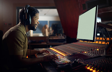 Image showing Happy, musician or technology mockup screen in music recording, sound mixing or studio song composition. Producer, happy or black man with computer headphones for dj radio, audio mock up or media app