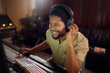 Image showing Headphones, recording studio and man music producer working a album, song or audio with equipment. Happy, smile and African male radio presenter playing playlist with technology in creative workplace