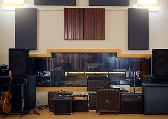 Image showing Recording studio, music and musical equipment for broadcast, radio or entertainment industry. Media, instruments and technology for a album or song production and sound track performance in a studio.