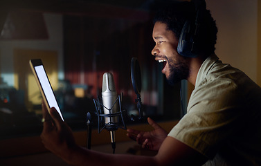 Image showing Tablet, singing or black man on studio microphone, mockup music or mock up lyrics in dark recording. Singer, musician or artist on technology production app, voice media or sound performance practice