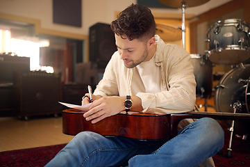 Image showing Idea, artist and musician writing a song for a performance, sound and talent in the studio. Creative, planning and artist with a guitar for music production, rehearsal and guitarist with a hobby