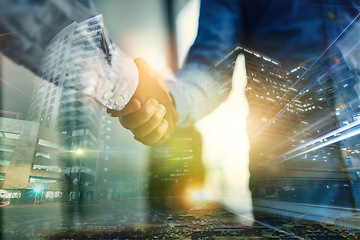 Image showing Digital, city or deal with business people shaking hands in agreement, promotion or b2b partnership. Overlay, handshake and thank you with a man employee in an urbane town to welcome a colleague