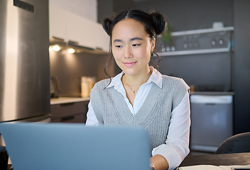 Image showing Remote work, laptop and freelancer woman is working at her home typing growth strategy or project online. Employee, worker or Asian consultant doing research for the business or startup