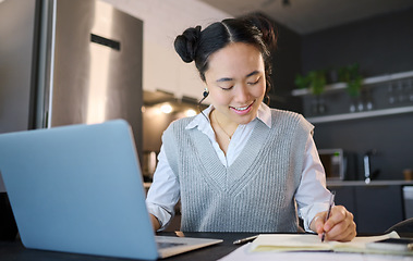 Image showing Idea, writing in notebook and business Asian woman with laptop working on report, budget and project at home. Remote work, success and female worker with computer for research, strategy and planning