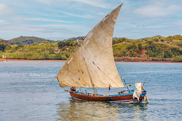 Image showing Malagasy fisher on sea in traditional handmade dugout wooden sailing boat