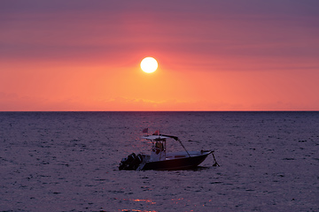 Image showing Sunset over Madagascar Nosy be beach with boat silhouette