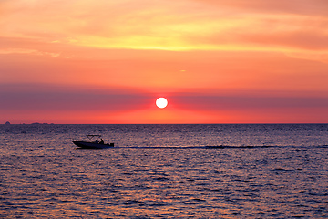 Image showing Sunset over Madagascar Nosy be beach with boat silhouette