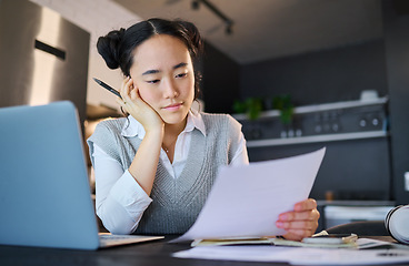 Image showing Thinking, remote work and Asian woman with documents, laptop and paperwork for working from home. Business, freelancer and female worker reading strategy report, project review and research ideas