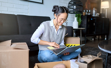 Image showing Planning, real estate and woman with a laptop while moving for apartment email and online contract. Mortgage, boxes and Asian girl typing on a computer for a relocation property idea in the lounge