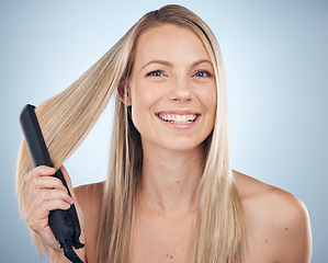 Image showing Hair straightener, face portrait and beauty of woman in studio isolated on gray background. Balayage, haircare and happy female model with flat iron product for hairstyle, grooming or salon treatment