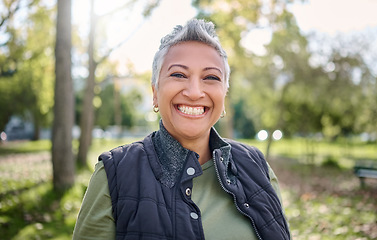 Image showing Nature, smile and portrait of senior woman in forest for adventure, freedom and hiking for fitness. Wellness, exercise and face of female enjoying fresh air, peace and healthy lifestyle in retirement