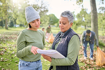 Image showing Volunteer schedule, community cleaning and charity work outdoor with women planning a project. Recycle team, collaboration and eco friendly job with people checking volunteering data in a park