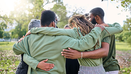 Image showing Group hug, support and people in park for eco friendly, sustainable or community service project, teamwork or love. Together, circle and diversity, inclusion friend in forest or nature for earth day