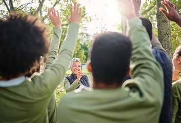 Image showing Volunteer, cleaning and group with vote for a woman in a park for the community environment. Teamwork, happy and people with questions for a senior leader during a nature cleanup for sustainability