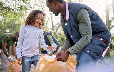 Image showing Trash, volunteer man and child cleaning garbage, pollution or waste product for community environment support. Plastic bottle container, NGO charity and nature park clean up by eco friendly black kid