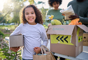 Image showing Food, donation and portrait of child in park with smile and grocery box, healthy diet at refugee feeding project. Girl, charity and donations help feed children and support from farm volunteer at ngo