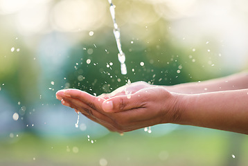 Image showing Outdoor, hands and man with water in nature for washing, cleaning or body hygiene hydration. Natural, organic and African male hand with aqua to wash or clean to prevent germs, dirt or dust outside.