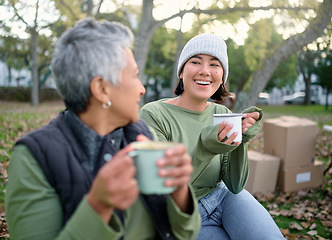 Image showing Coffee, break and volunteer relax during community, cleanup and project in a park, happy and bonding. Charity, environment and recycling friends resting in a forest with tea, cheerful and content