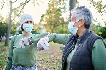 Image showing Covid, community volunteer women and cleaning trash pollution, garbage waste product or environment support. Corona virus greeting, NGO charity and eco friendly team help with nature park clean up