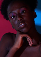 Image showing Cool, aesthetic and portrait of black woman in dark color lighting isolated on a studio background. Neon, art and face of an African girl with creativity, makeup and stylish on a creative backdrop