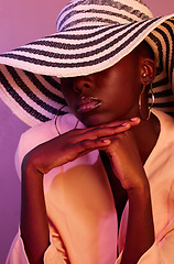 Image showing Fashion, sun hat and black woman in a studio with neon light for aesthetic with beauty and trend. Stylish summer accessory, UV and young African female model with style by a purple background.