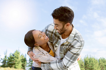 Image showing Sky, diversity and nature couple hug on outdoor quality time together, hiking adventure or forest bonding journey. Peace, freedom and love for black woman, man or fun excited people trekking in woods