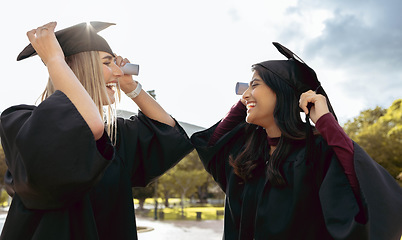 Image showing Graduate women, friends and smile together with graduation cap, congratulations and success for studying. University student, gen z girl and excited with diversity, goal and happiness for achievement