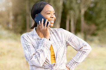 Image showing Black woman, forest and phone call for talking, thinking and smile on grass in summer sunshine. Adventure holiday, comic smartphone conversation or funny talk for girl for networking, woods and joke