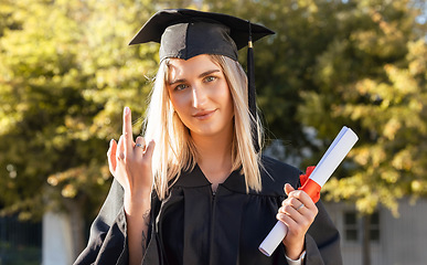 Image showing University student woman, middle finger and holding certificate in portrait, hand sign and success. Gen z girl, graduate celebration and education with smile, happiness or diploma for degree