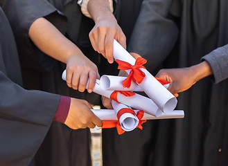 Image showing Graduation, graduate celebration and hands with diploma, together with support, community and college people achievement. University degree, education and learning growth with ceremony and solidarity